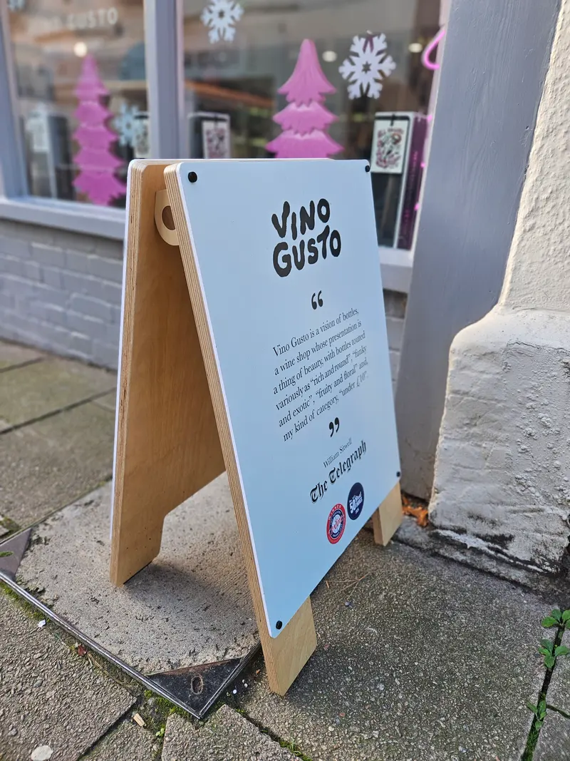 Plywood pavement A-board outside a shop