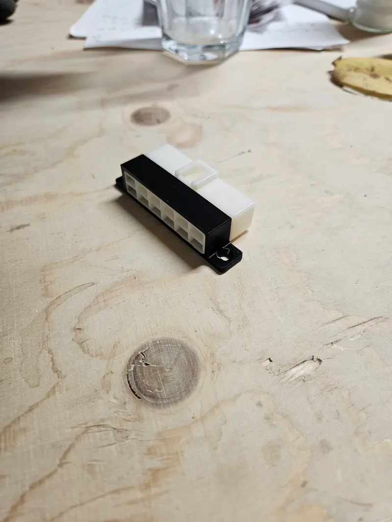 Small black and white 3D printed connector housing
